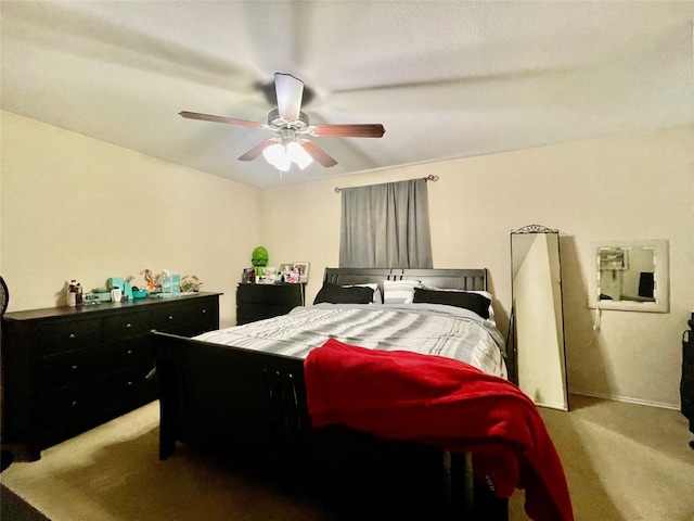 bedroom featuring ceiling fan and carpet flooring