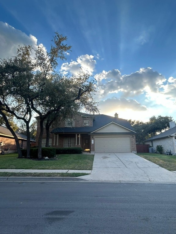 view of front facade with a garage and a front lawn