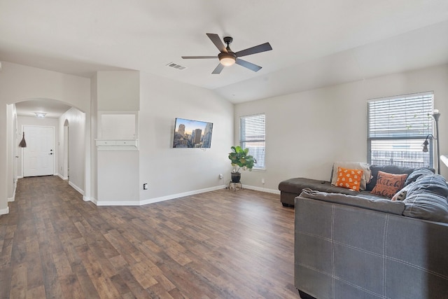 living room with ceiling fan, dark hardwood / wood-style floors, and lofted ceiling