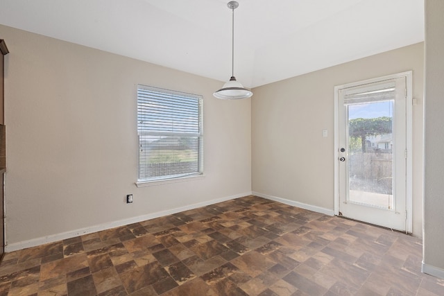 unfurnished dining area featuring a healthy amount of sunlight