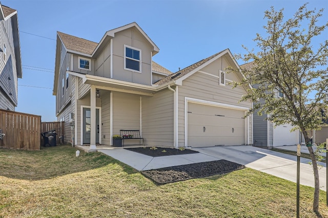 view of front of property featuring a garage and a front lawn