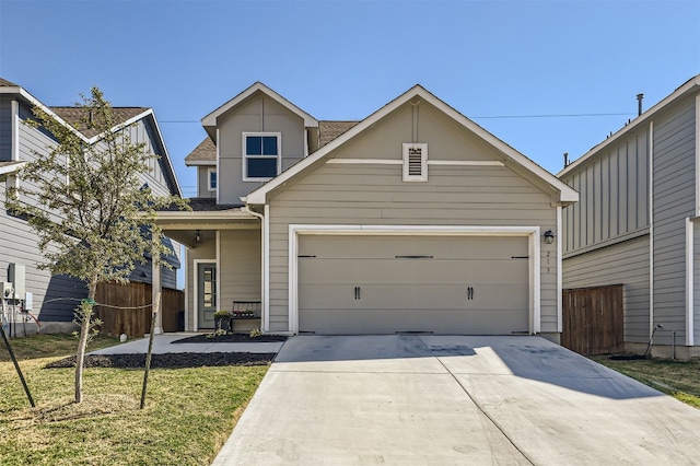 view of front of property featuring a front lawn and a garage