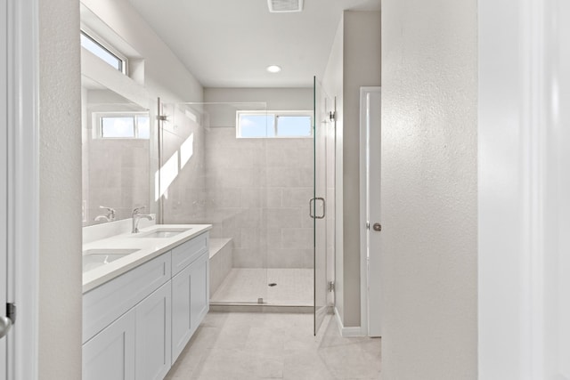 bathroom featuring an enclosed shower, tile patterned floors, and vanity