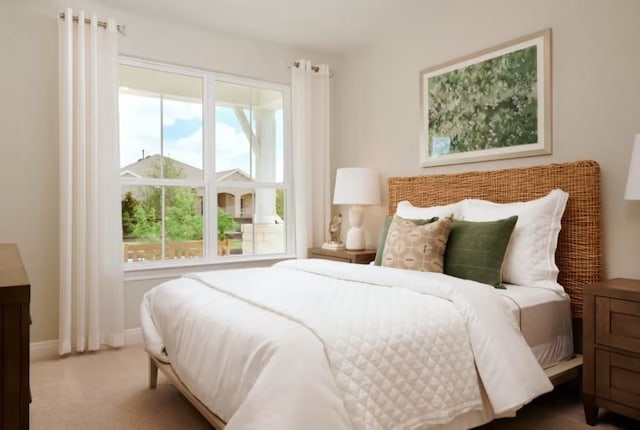 bedroom with carpet flooring and multiple windows