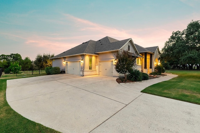 view of front facade featuring a yard and a garage