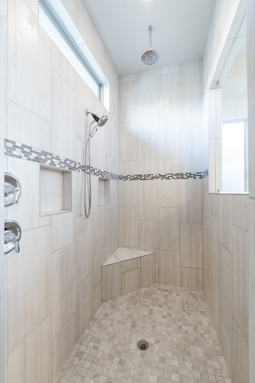 bathroom featuring a tile shower