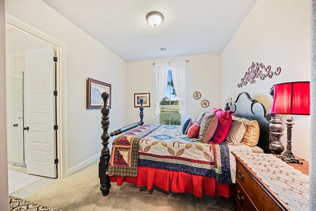 bedroom with light colored carpet