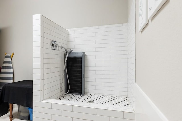 bathroom with tiled shower