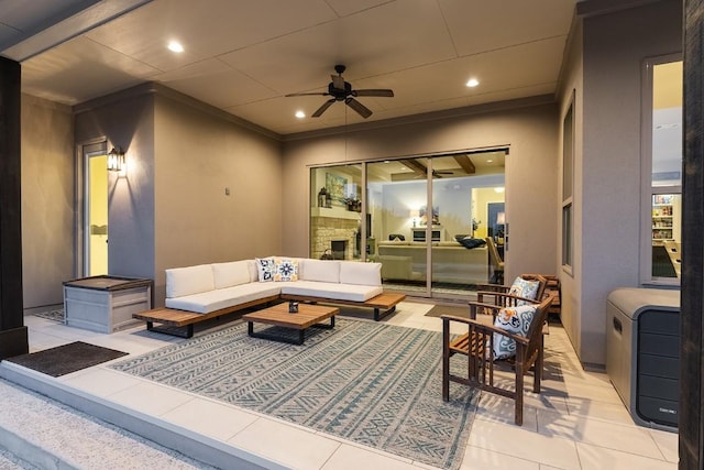 view of patio / terrace with an outdoor living space and ceiling fan