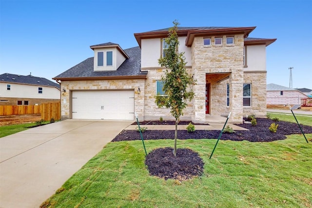 view of front of home with a front lawn and a garage