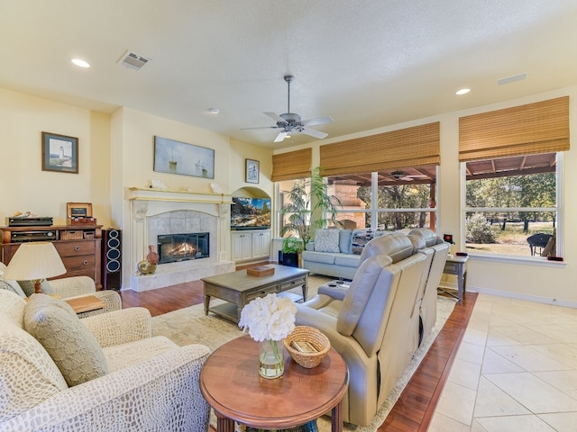 26801 Founders Pl, Spicewood, TX 78669 - living area featuring ceiling fan, recessed lighting, a high end fireplace, and baseboards