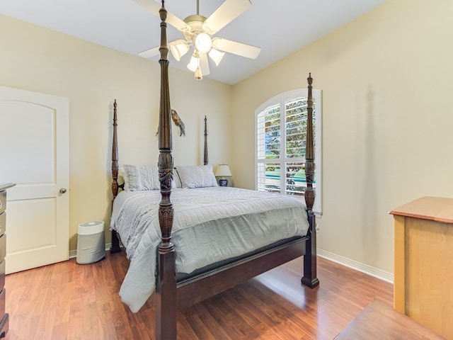 26801 Founders Pl, Spicewood, TX 78669 - bedroom with wood finished floors, a ceiling fan, and baseboards