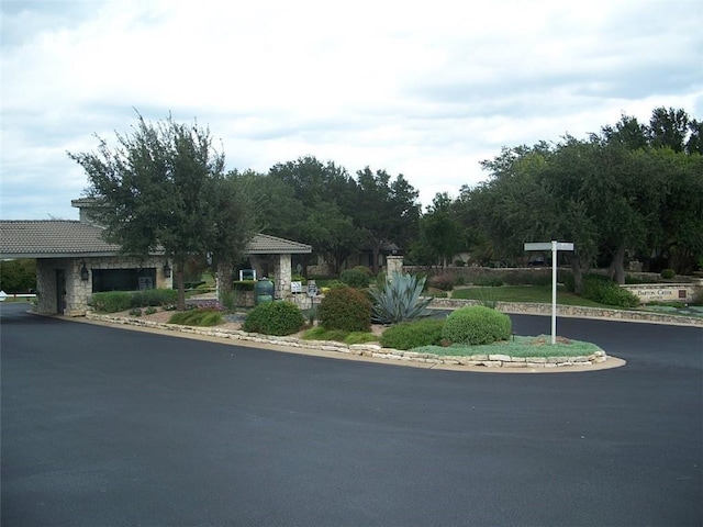 26801 Founders Pl, Spicewood, TX 78669 - view of front facade featuring stone siding