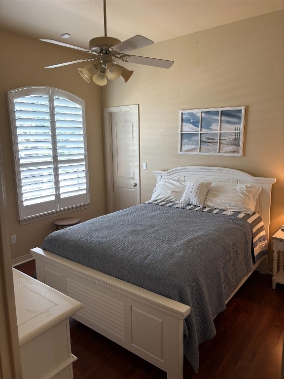 26801 Founders Pl, Spicewood, TX 78669 - bedroom with dark wood-style floors and ceiling fan
