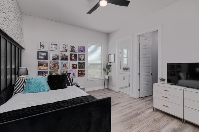 501 Francis Ct, Liberty Hill, TX 78642 - bedroom featuring light wood-style floors, ensuite bathroom, ceiling fan, and baseboards