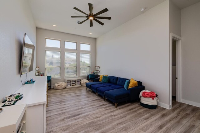 501 Francis Ct, Liberty Hill, TX 78642 - living room featuring ceiling fan, light wood-style flooring, recessed lighting, a high ceiling, and baseboards