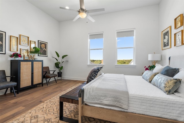 bedroom featuring ceiling fan and dark hardwood / wood-style flooring