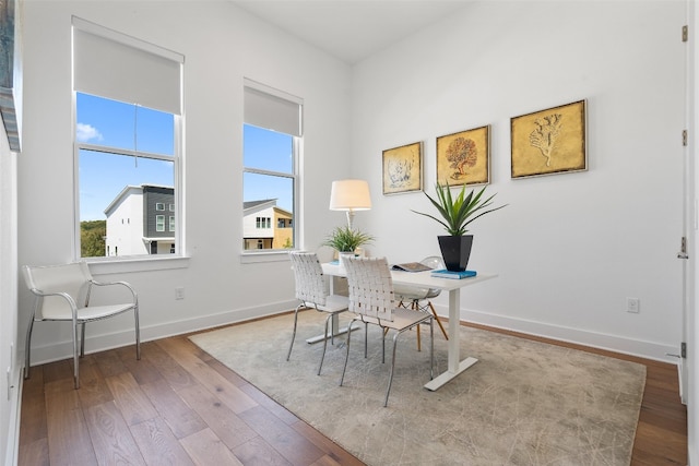 home office featuring light wood-type flooring and a healthy amount of sunlight