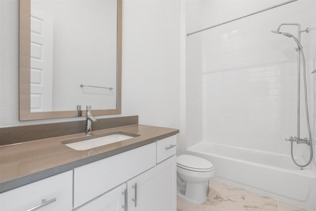 full bathroom featuring tiled shower / bath, vanity, and toilet