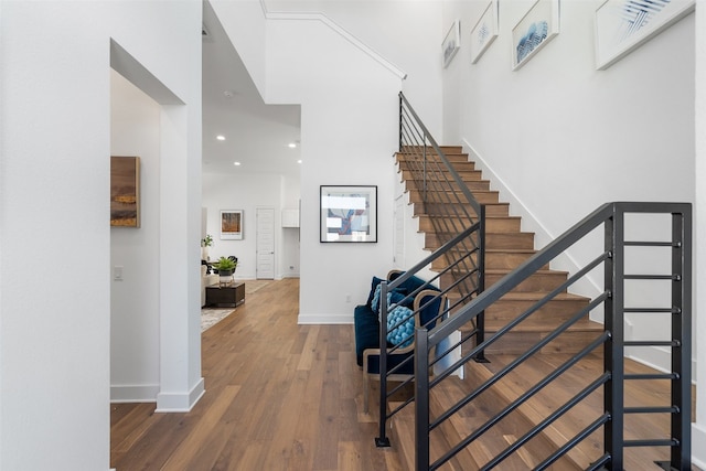 stairs with hardwood / wood-style floors