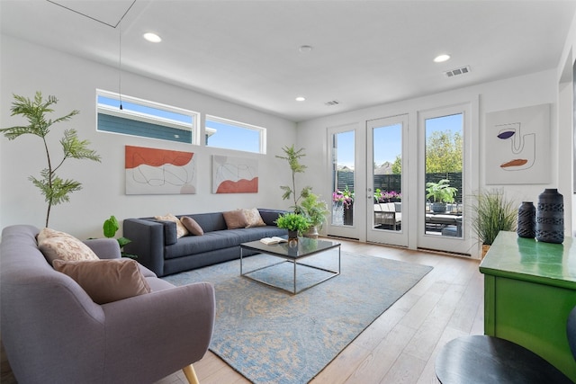 living room with light hardwood / wood-style flooring