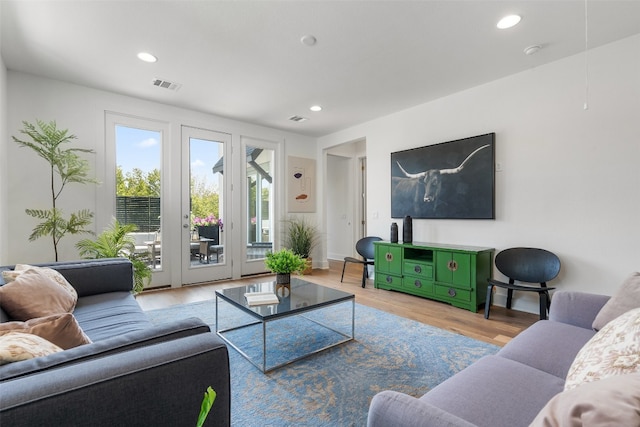 living room with light hardwood / wood-style floors