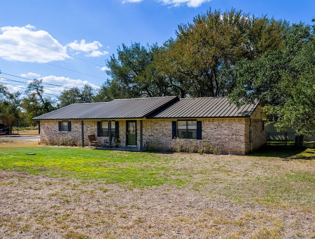 ranch-style home with a front lawn