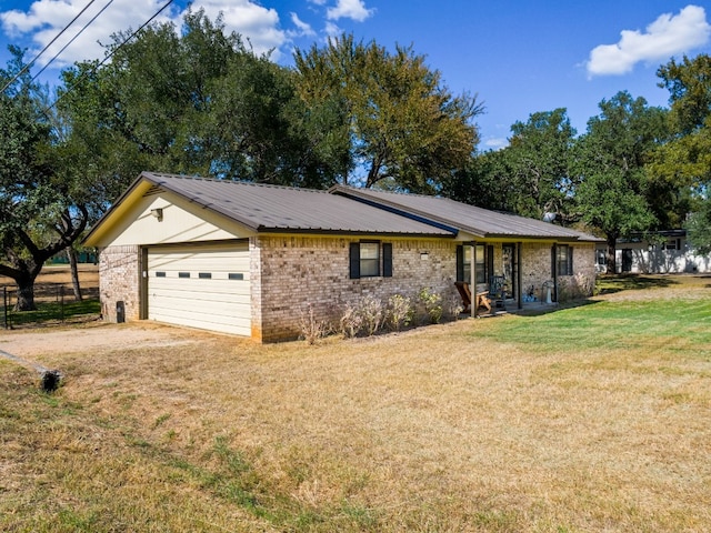 ranch-style home with a front lawn and a garage