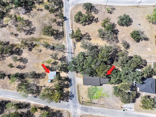 birds eye view of property with a rural view