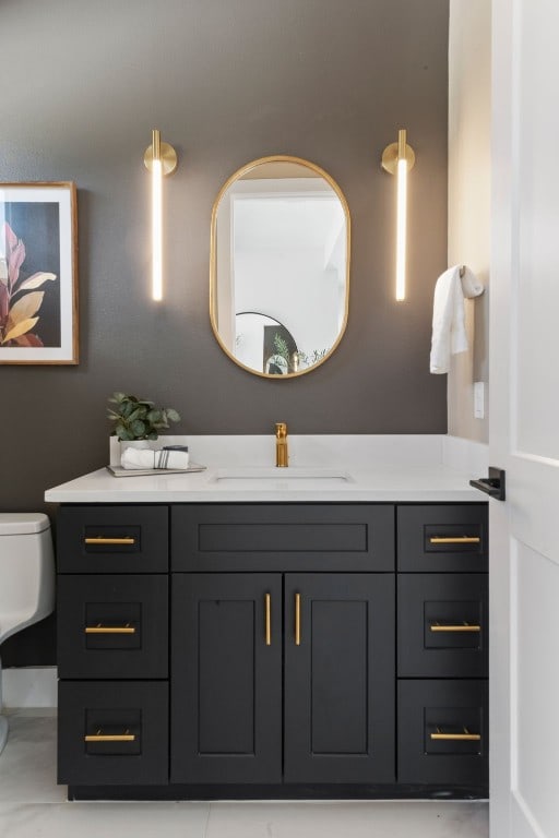 bathroom with vanity and toilet