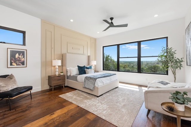 bedroom featuring ceiling fan and dark hardwood / wood-style flooring