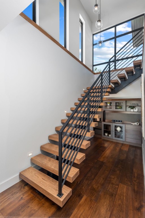 stairway featuring wood-type flooring