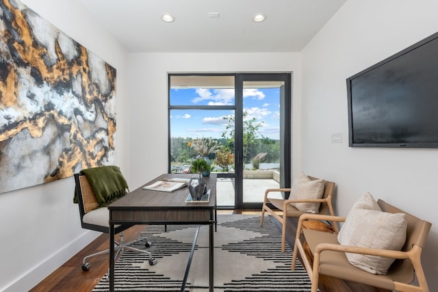 office space with hardwood / wood-style flooring