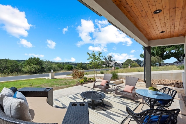 view of patio featuring an outdoor fire pit