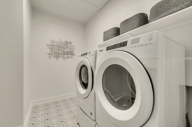 washroom featuring independent washer and dryer