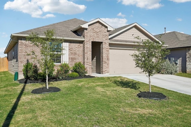 view of front of property featuring a garage and a front lawn