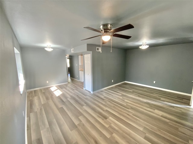 unfurnished room with wood-type flooring and ceiling fan