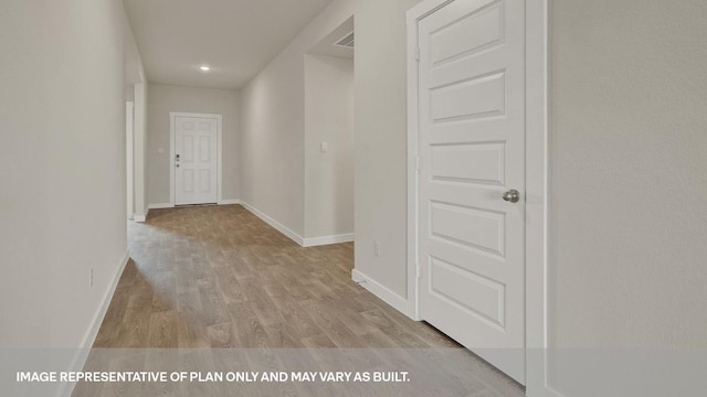 hallway with light wood-type flooring