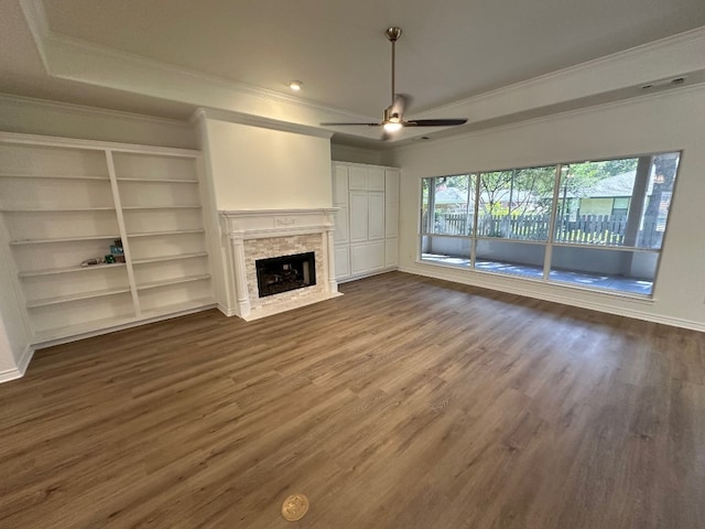 unfurnished living room featuring wood-type flooring, crown molding, and ceiling fan