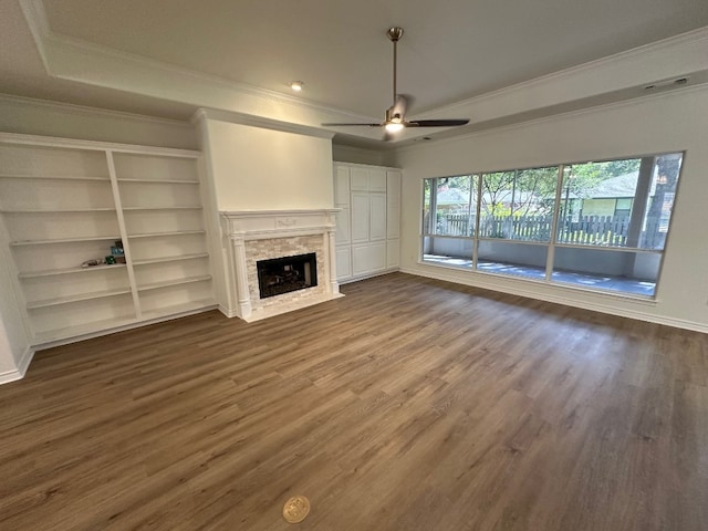 307 Stewart St, Meadowlakes, TX 78654 - unfurnished living room with ceiling fan, ornamental molding, dark wood-type flooring, a fireplace with flush hearth, and baseboards