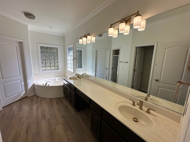 bathroom featuring crown molding, separate shower and tub, hardwood / wood-style flooring, vanity, and a textured ceiling