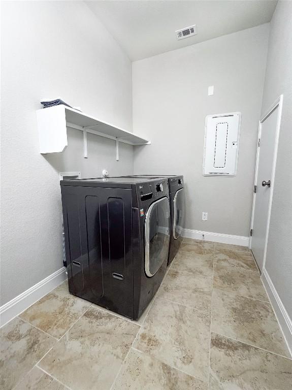 6008 Genova Pl, Round Rock, TX 78665 - laundry room with electric panel and washer and dryer