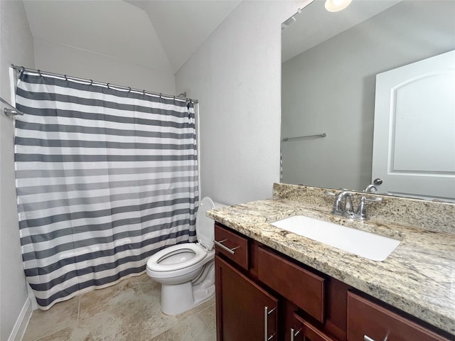 bathroom featuring vaulted ceiling, toilet, walk in shower, and vanity