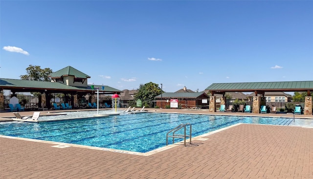 view of swimming pool with a patio