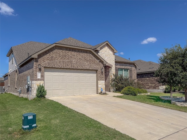 view of front facade featuring a front yard, cooling unit, and a garage