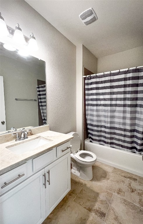 full bathroom featuring shower / bath combo, toilet, and vanity