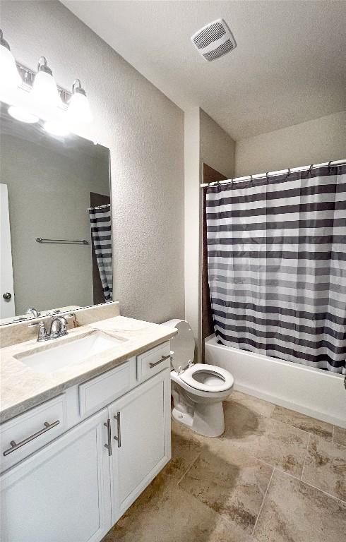 6008 Genova Pl, Round Rock, TX 78665 - full bath featuring a textured wall, vanity, and shower / tub combo