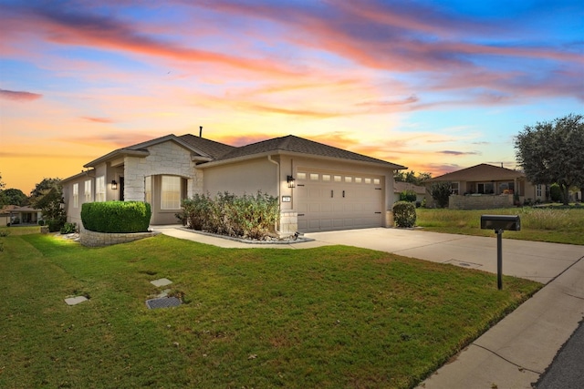 view of front facade featuring driveway, a garage, stone siding, a front lawn, and stucco siding