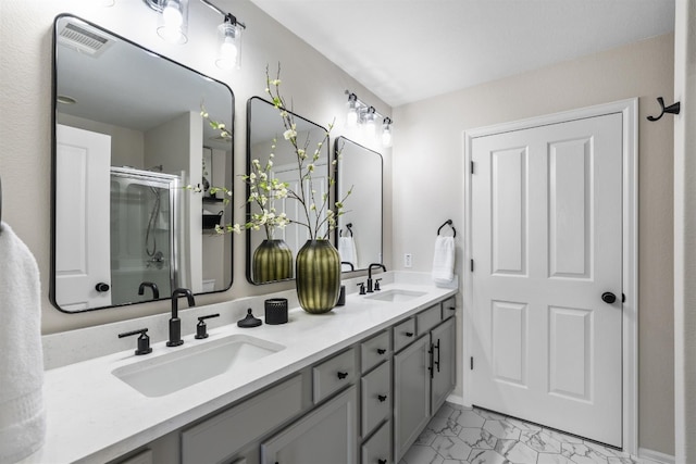 208 Bright Leaf Trl, Georgetown, TX 78633 - full bathroom with a shower stall, marble finish floors, and double vanity