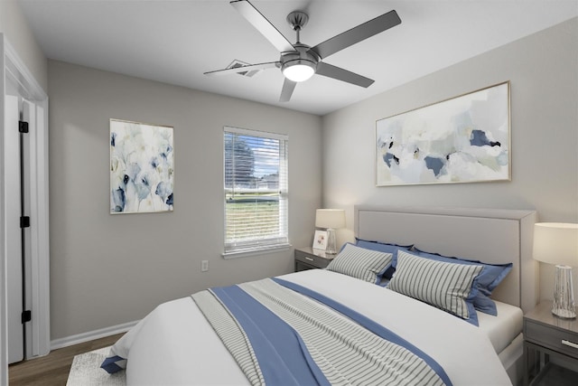 bedroom with ceiling fan and wood-type flooring